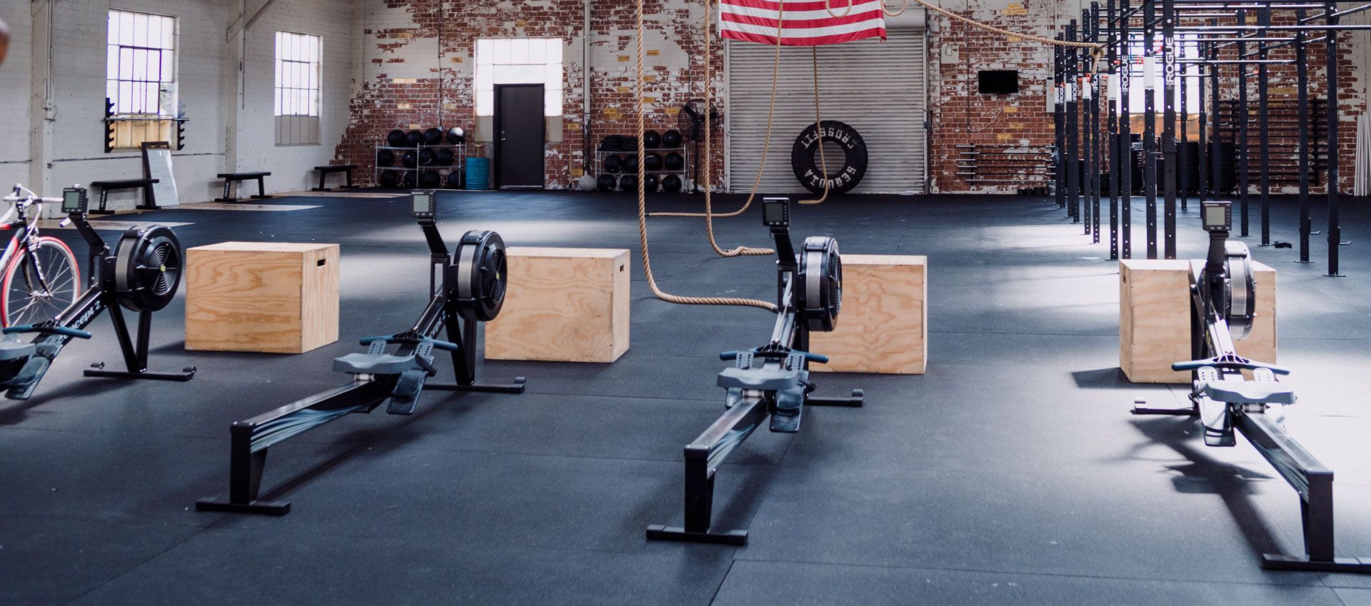 black and gray dumbbells on floor