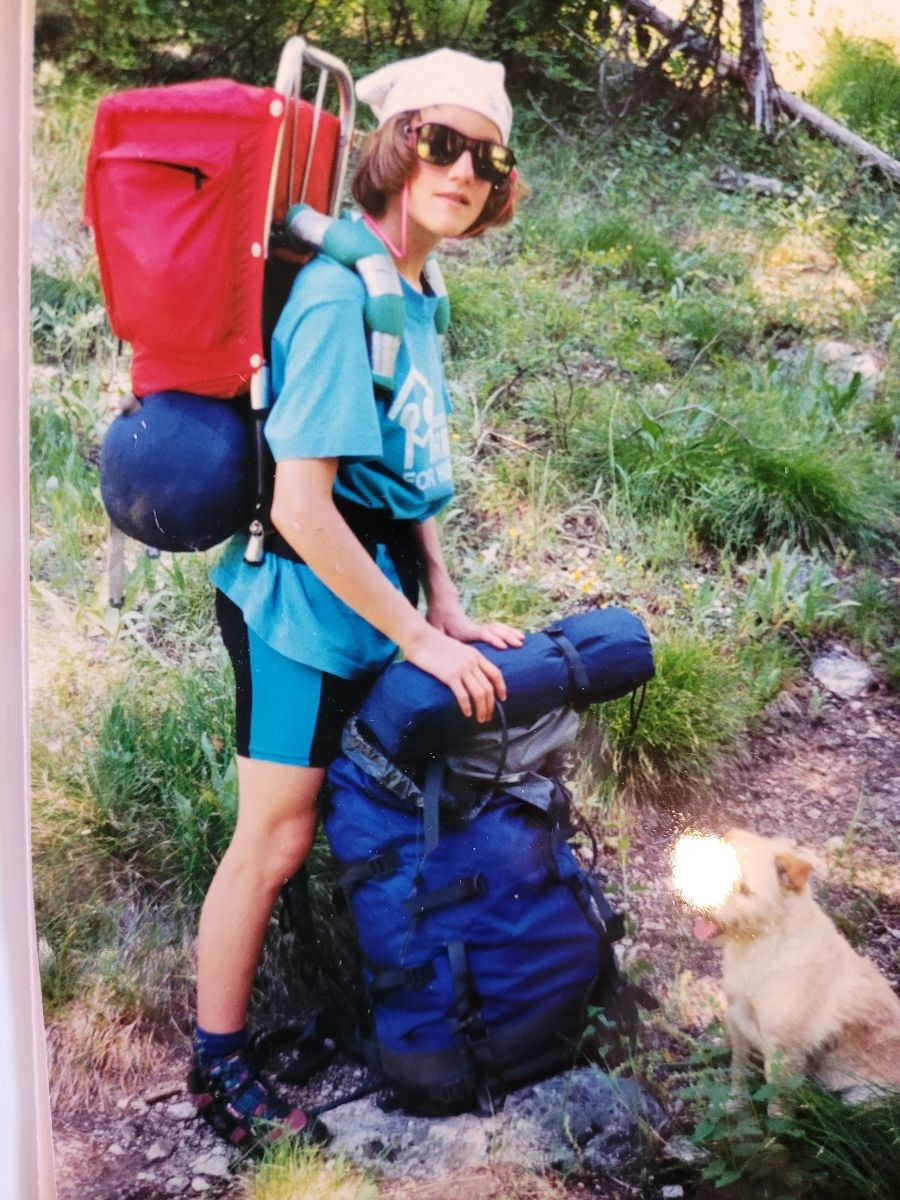 a night scene of a mountain and a lake
